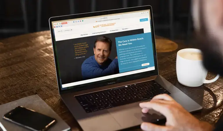 The Michael J. Fox Foundation website on a laptop screen